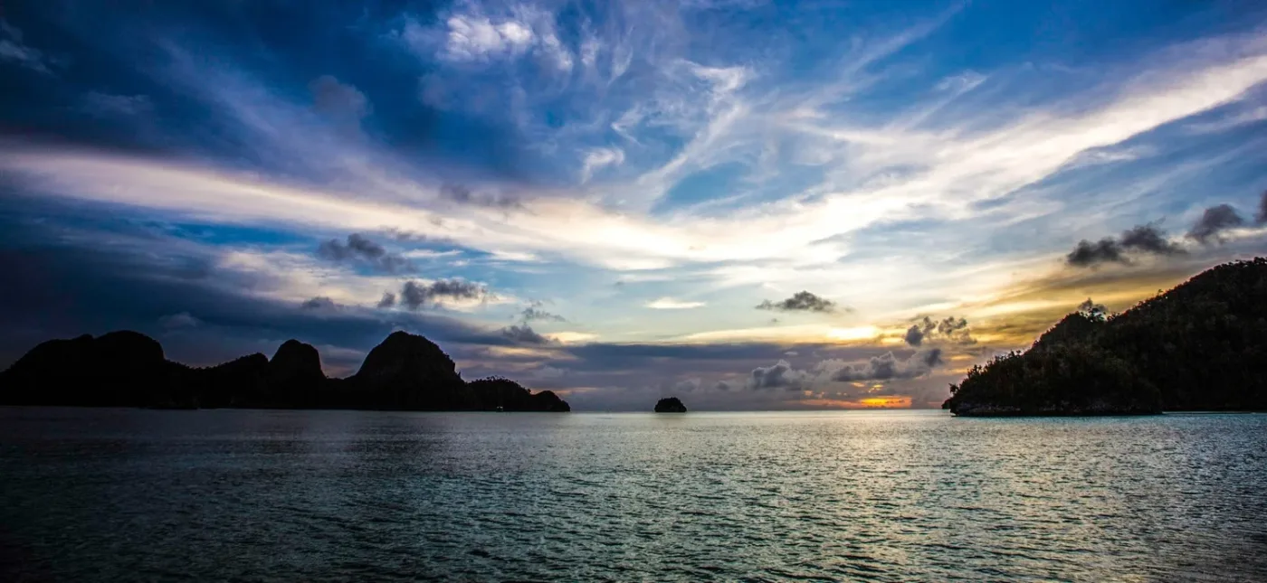 Sunset over the islands of the Gulf of Thailand from the boat